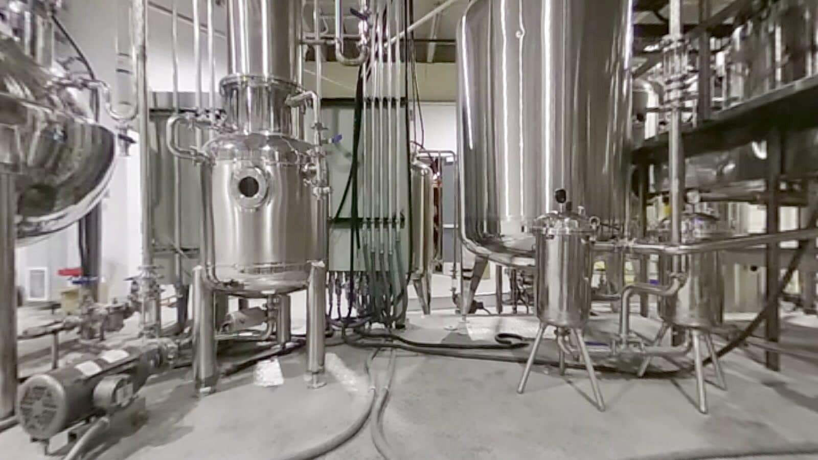 Filter housings, pumps and tanks on a process floor